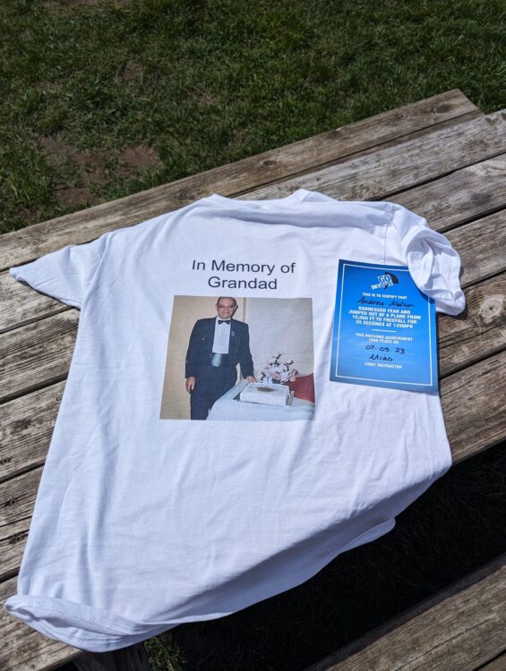white t-shirt with photo of man on the back and the words in memory of grandad